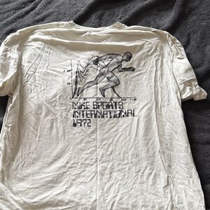 Nike cream Graphic Tee with Runner Design